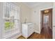 Charming mud room features a bright window, storage cabinets, and a stylish sink for added convenience at 55 Fleming Forest Dr, Youngsville, NC 27596