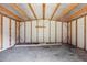 Empty storage shed with wooden framing and open ceiling at 55 Fleming Forest Dr, Youngsville, NC 27596