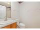 The bathroom features a single sink vanity, toilet, and combination shower and tub at 5600 Sherrif W Pl, Raleigh, NC 27610