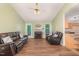 Inviting living room with vaulted ceiling, fireplace, wood flooring and natural light at 5600 Sherrif W Pl, Raleigh, NC 27610