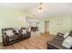 Comfortable living room features wood flooring, a vaulted ceiling and open to the dining area at 5600 Sherrif W Pl, Raleigh, NC 27610