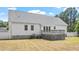Back exterior of home with gray roof, white siding, and a wood deck at 5612 Sandy Trail Dr, Knightdale, NC 27545