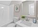 Bathroom with tub, white vanity and a framed mirror at 5612 Sandy Trail Dr, Knightdale, NC 27545