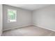 Bright bedroom offering natural light, neutral carpet, and ample space at 5612 Sandy Trail Dr, Knightdale, NC 27545