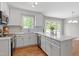 Modern kitchen featuring white cabinets, stainless steel appliances, and an island for extra counter space at 5612 Sandy Trail Dr, Knightdale, NC 27545