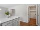Open layout kitchen featuring an island and an adjacent pantry and laundry room at 5612 Sandy Trail Dr, Knightdale, NC 27545