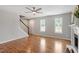 Open living room featuring hardwood floors, fireplace and staircase at 5612 Sandy Trail Dr, Knightdale, NC 27545