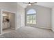 Large main bedroom with vaulted ceiling, big window, and ensuite bathroom at 5612 Sandy Trail Dr, Knightdale, NC 27545