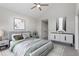 Relaxing bedroom with neutral tones, featuring a ceiling fan, and ample closet space at 5612 Sandy Trail Dr, Knightdale, NC 27545
