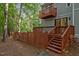 Wooden deck area with stairs and fenced-in area for outdoor living at 568 Piney Mountain Rd, Chapel Hill, NC 27514