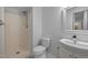 Simple bathroom featuring a shower, toilet, and vanity with a sink at 568 Piney Mountain Rd, Chapel Hill, NC 27514