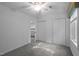 White bedroom with neutral carpet, light walls, a ceiling fan, and a large closet at 568 Piney Mountain Rd, Chapel Hill, NC 27514