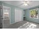 Bedroom featuring light-blue walls, a ceiling fan, a closet, and an attached desk at 568 Piney Mountain Rd, Chapel Hill, NC 27514