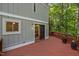 Back deck with access to home interior and railing and natural views at 568 Piney Mountain Rd, Chapel Hill, NC 27514
