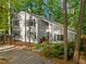 Exterior shot featuring a well-maintained home, mature trees and a covered parking area at 568 Piney Mountain Rd, Chapel Hill, NC 27514