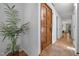 Warm foyer featuring a wooden door, tile accents, and a glimpse into adjacent living spaces at 568 Piney Mountain Rd, Chapel Hill, NC 27514