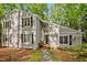 Two-story home with a modern design and lush landscaping in a serene wooded setting at 568 Piney Mountain Rd, Chapel Hill, NC 27514