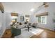 Spacious and airy living room with a skylight, neutral decor, and comfortable seating at 568 Piney Mountain Rd, Chapel Hill, NC 27514