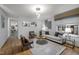 Bright living room featuring modern lighting, stylish furniture, and light hardwood flooring at 568 Piney Mountain Rd, Chapel Hill, NC 27514