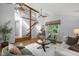 Bright living room with vaulted ceilings, hardwood floors, and stylish contemporary furnishings at 568 Piney Mountain Rd, Chapel Hill, NC 27514
