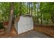 Durable storage shed nestled in a wooded area, perfect for tools and outdoor equipment at 568 Piney Mountain Rd, Chapel Hill, NC 27514