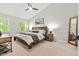 Vaulted bedroom featuring neutral colors, natural light, and wood furniture at 5701 Hadrian Dr Dr, Durham, NC 27703