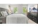 Comfortable bedroom featuring a king-sized bed, natural light, and a serene atmosphere at 5701 Hadrian Dr Dr, Durham, NC 27703