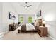 Vaulted bedroom featuring neutral colors, natural light, wood furniture, and ceiling fan at 5701 Hadrian Dr Dr, Durham, NC 27703