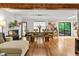 Open-concept dining area showcasing a dining table, chairs, and a cozy fireplace at 5701 Hadrian Dr Dr, Durham, NC 27703