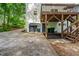 Home exterior featuring a garage, covered deck with stairs, and a backyard at 5701 Hadrian Dr Dr, Durham, NC 27703