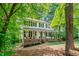 Inviting two-story home with a covered front porch, complete with classic black shutters and beautiful landscaping at 5701 Hadrian Dr Dr, Durham, NC 27703