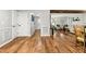 Spacious living room featuring hardwood floors, wainscoting, and natural light at 5701 Hadrian Dr Dr, Durham, NC 27703