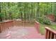 View from deck overlooking a beautiful wooded backyard with a storage shed at 5825 Scalybark Rd, Durham, NC 27712