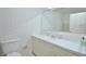 Bathroom with a floral-patterned wall, a toilet and vanity with a large mirror at 5825 Scalybark Rd, Durham, NC 27712
