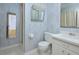 Classic bathroom featuring vanity, toilet, and framed mirror for morning routines at 5825 Scalybark Rd, Durham, NC 27712
