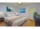 Stylishly staged bedroom with coordinated decor and ample natural light at 5825 Scalybark Rd, Durham, NC 27712