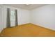 Bright bedroom featuring a window with curtains, light walls, and carpeted flooring at 5825 Scalybark Rd, Durham, NC 27712