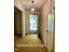 Inviting entry foyer with natural light, showcasing the entrance to the home with classic flooring at 5825 Scalybark Rd, Durham, NC 27712