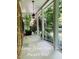 Spacious front porch featuring classic columns and blooming flowers, perfect for relaxing outdoors at 5825 Scalybark Rd, Durham, NC 27712