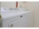 Close-up of white appliances in a laundry room at 5825 Scalybark Rd, Durham, NC 27712