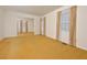 Bright living room featuring carpet flooring, large windows, and an open doorway into another room at 5825 Scalybark Rd, Durham, NC 27712