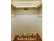 Spacious Primary bedroom walk-in closet providing ample storage with shelving and hanging rods at 5825 Scalybark Rd, Durham, NC 27712