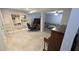 Finished basement with tile floors, built-in bookshelves, and a separate seating area at 6125 Bellow St, Raleigh, NC 27609