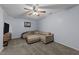 Cozy finished basement area featuring comfortable seating and neutral carpeting at 6125 Bellow St, Raleigh, NC 27609