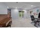 Spacious finished basement showcasing tile flooring, a piano, and built-in shelving at 6125 Bellow St, Raleigh, NC 27609