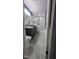 Stylish bathroom with modern vanity, updated fixtures, and a shower-tub combination at 6125 Bellow St, Raleigh, NC 27609