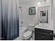 Updated bathroom with shower-tub combo, stylish vanity, and modern fixtures at 6125 Bellow St, Raleigh, NC 27609