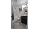 Bathroom featuring modern fixtures, tub/shower combo, and gray tile flooring at 6125 Bellow St, Raleigh, NC 27609