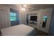Cozy bedroom featuring a closet, modern ceiling fan, and contemporary decor at 6125 Bellow St, Raleigh, NC 27609