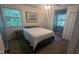 Comfortable bedroom with two windows, a closet and neutral colors at 6125 Bellow St, Raleigh, NC 27609